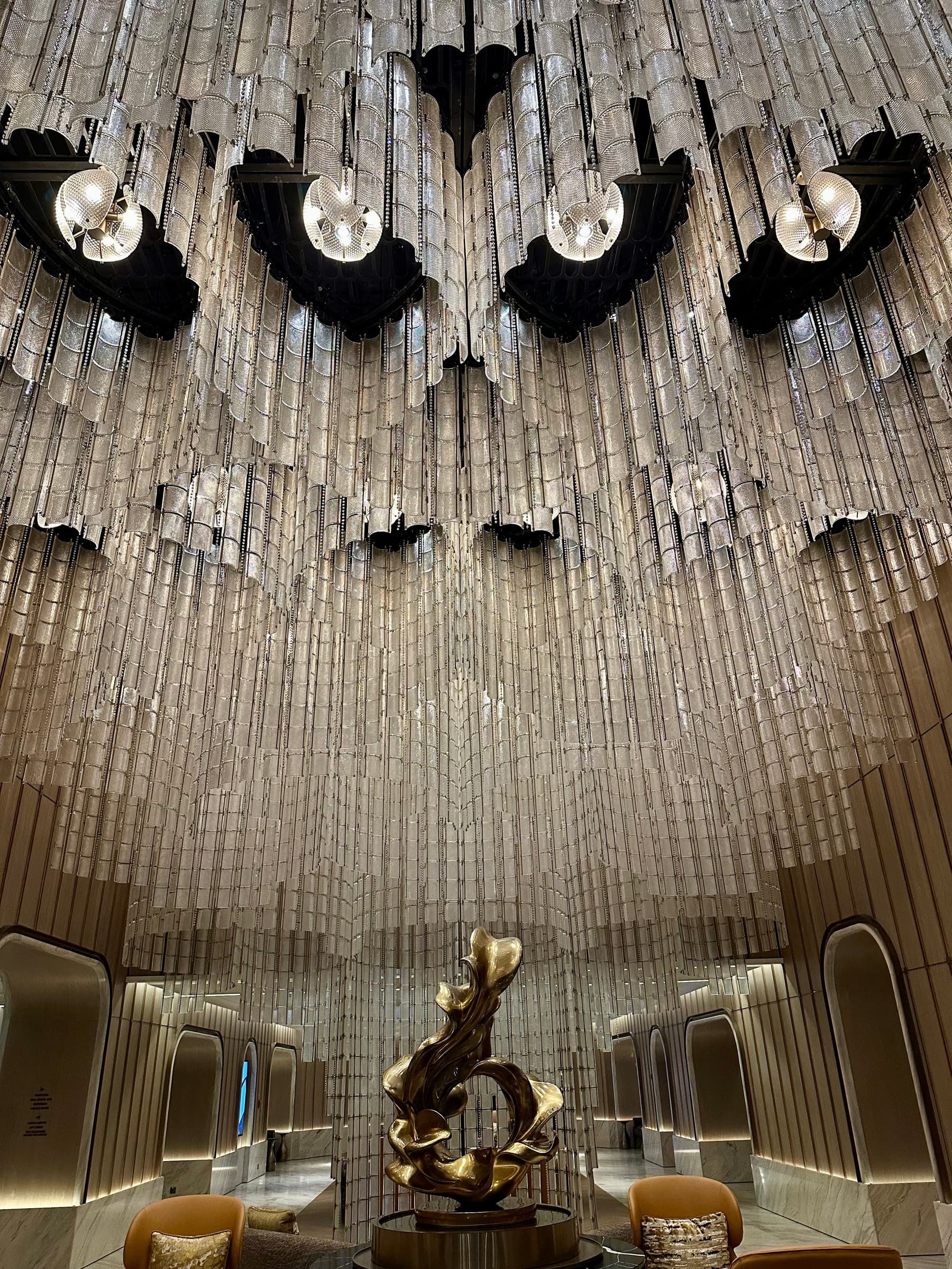 The lobby chandelier and central sculpture at Fairmont Bangkok Sukhumvit.